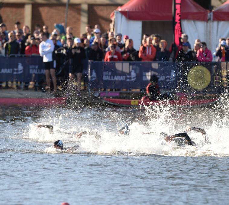 Open water: The competitors swam 2km in Lake Wendouree for the first leg of the Ironman 70.3. 