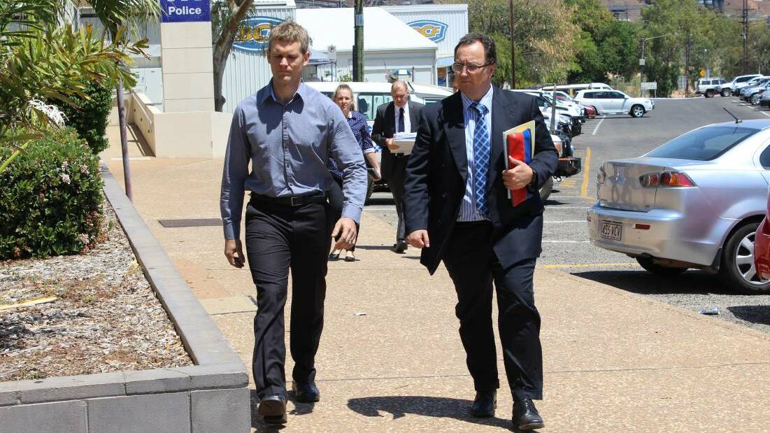 Boy Allan Page walks into Mount Isa Magistrates Court with lawyer Anderson Telford.