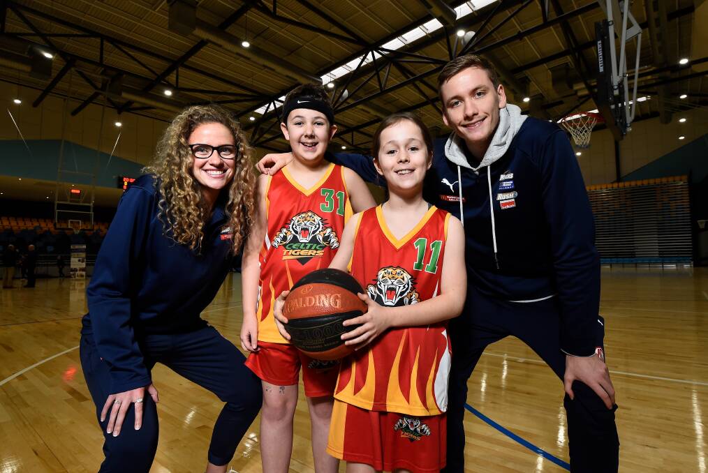 Homegrown Ballarat Rush and Miners players Amelia Jarvis and Sam Short with young Celtic Tigers players Jackson Guthridge, 11, and Stella Quon, 10, at the Ballarat Sports and Events Centre official opening. Picture: Adam Trafford 