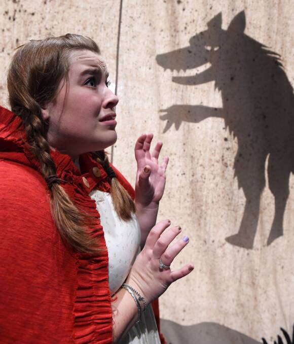 A grim sight: Emily Roberts, aka Little Red Riding Hood, encounters a frightening vision. Ms Roberts and her third-year music theatre classmates will perform Into the Woods from October 1 to 8. Picture: Lachlan Bence
