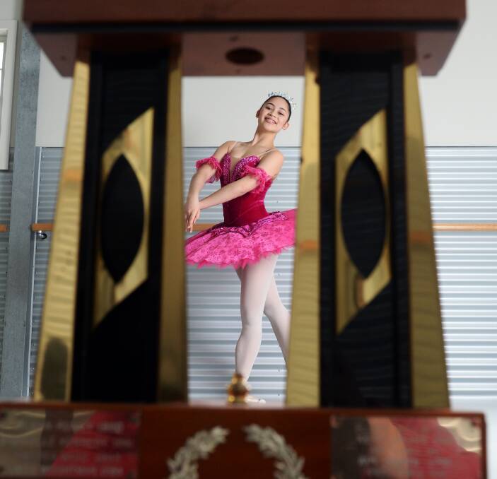 En pointe: Ada Sayasane, 15, and her Royal South Street trophy. She has accomplished the rare feat of winning all four major accolades and has also been selected for an international competition. Picture: Kate Healy