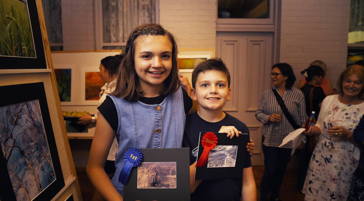 Healing together: Brother-and-sister team Amy and Lucas Wells at the Scotsburn Art Exhibition, which was launched at Buninyong on Sunday. Picture: Luka Kauzlaric