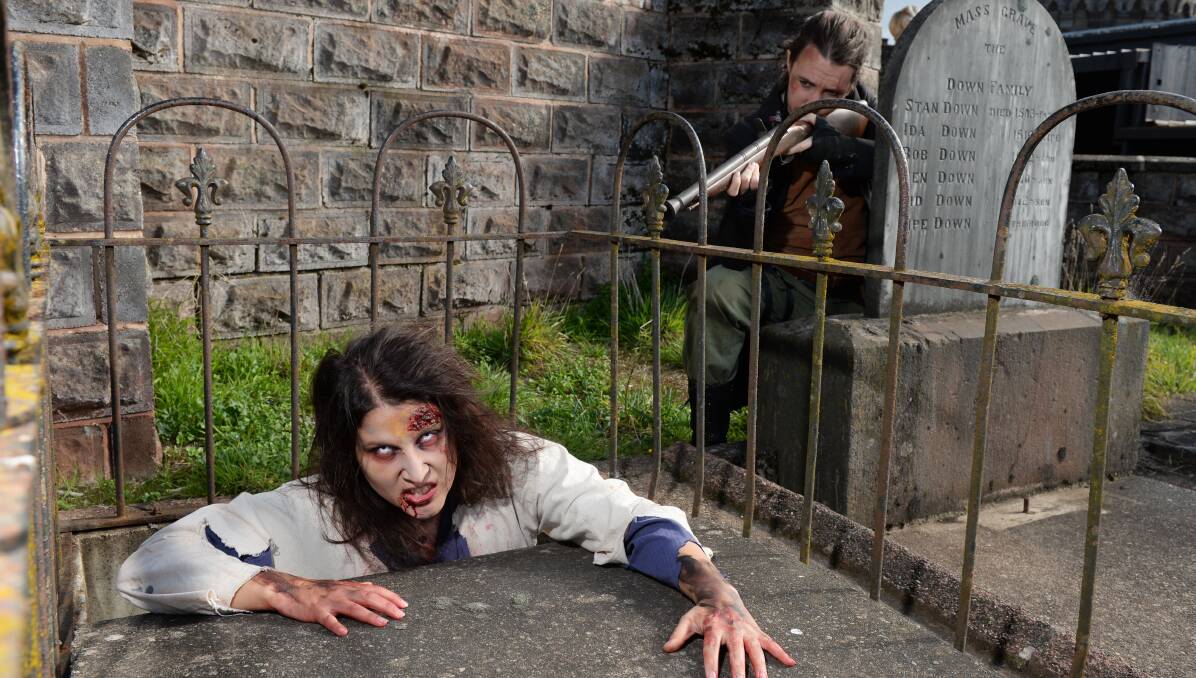 A night of gore: Zombie Rebecca Penzi emerges from her grave as survivor Paul Quartermain halts her gruesome return. Picture: Kate Healy