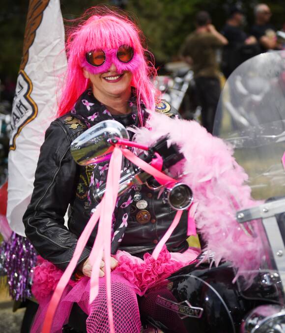 Pinked up: Kerry Jenkinson of the Yarra Valley chapter of the Hogs gets dressed up for the Pink Ribbon Motorcycle Ride alongside her burly, blokey counterparts. Picture: Luka Kauzlaric