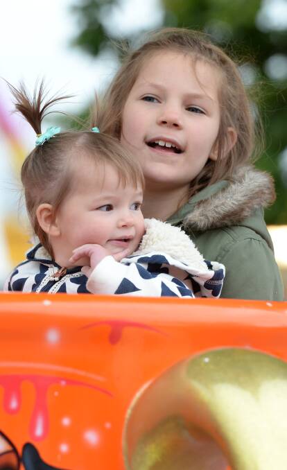 Spinning: Matilda Fary, 1, and Renee Bardsley, 8, of Maryborough, enjoy Ballarat's answer to Disneyland's Mad Tea Party. All pictures: Kate Healy