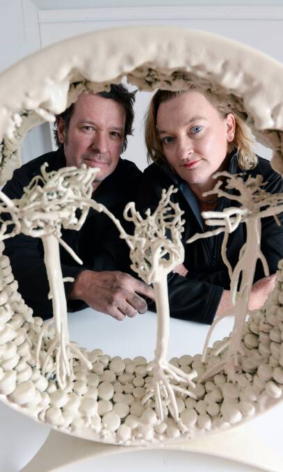 Changing the landscape: Derek John and Julie Collins with one of their sculptures. They are commissioning more than 150 artists for original works. Picture: Kate Healy