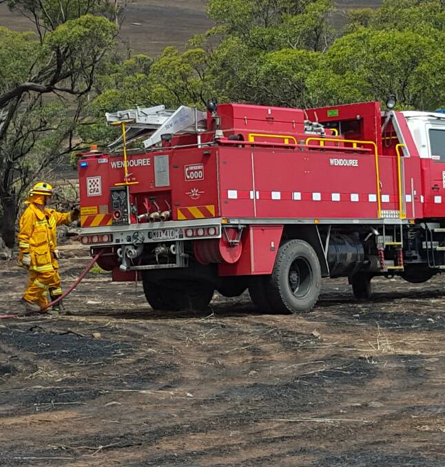 Control lines: The Wendouree brigade helps patch out hot spots in South Australia's mid-north, helping give local firefighters a break. Picture: supplied by CFA