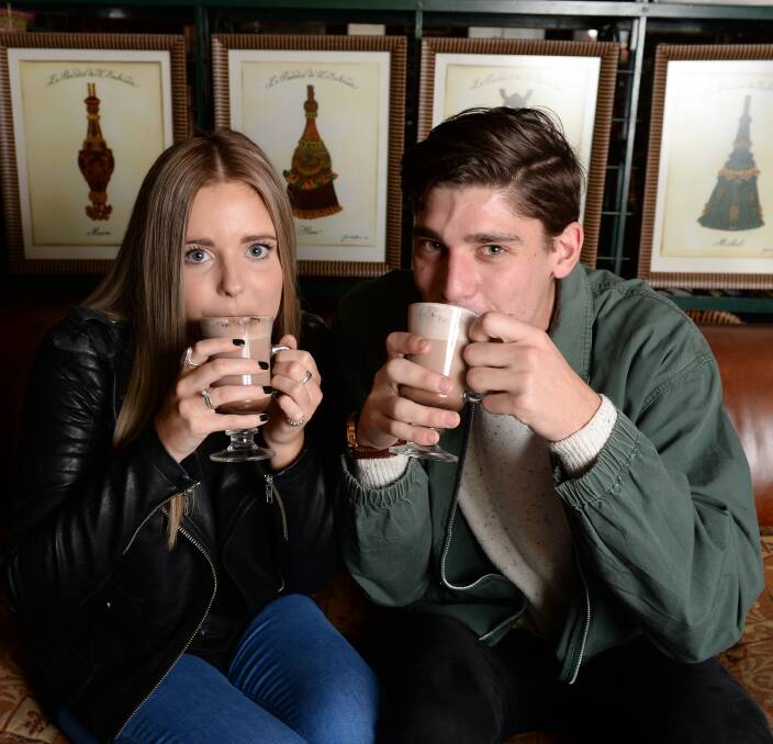 Walking and sipping: Alicia Quilliam and Josh Benfield sipping hot chocolates at Craig's Royal Hotel, ahead of Winterlude's Hot Chocolate Walking Tours. Picture: Kate Healy