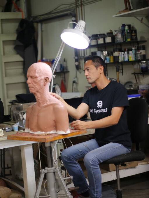 Artist at work: Hiroshi Katagiri sculpting one of the terrifying figures for his film Gehenna - Where Death Lives, which will launch in Ballarat on November 29.
