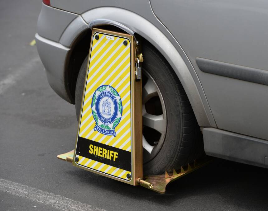 Gotcha: Seventeen shoppers in Ballarat on Wednesday returned to the car park to find their wheels had been clamped. Picture: Kate Healy