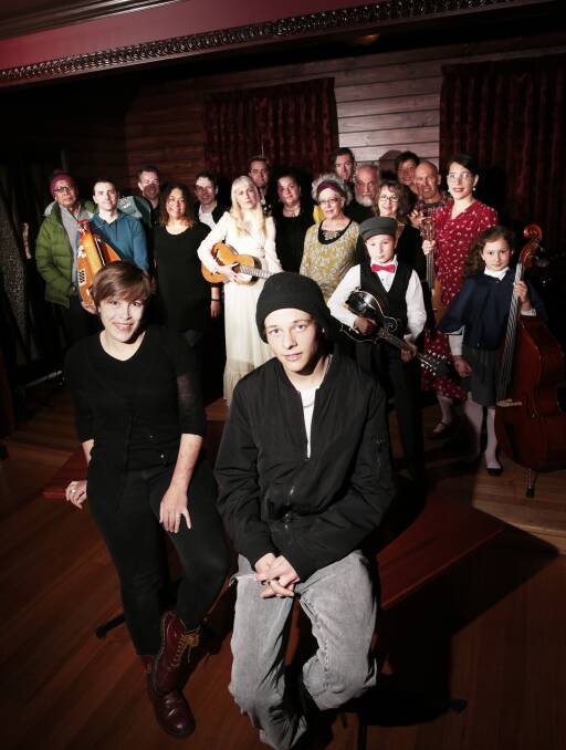 Local sounds: Paige Duggan and Mitchell Burgess with a host of musicians who will perform during the SongWays festival. Picture: Luka Kauzlaric
