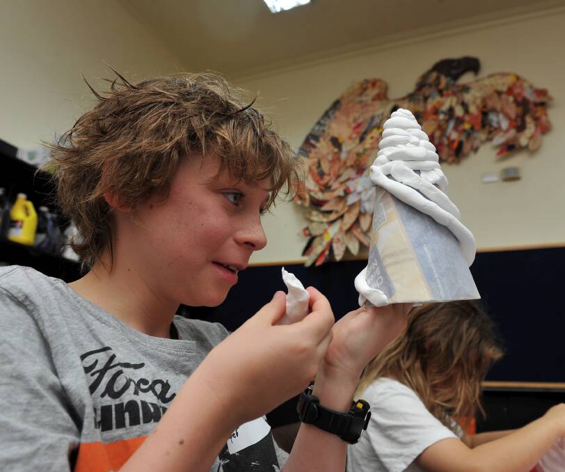 Shapes and sculptures: Cooper Sutherland, 10, learns how to use modelling clay to create artistic vessels at the Art Gallery of Ballarat. Picture: Lachlan Bence