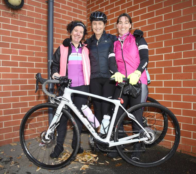 Pink for a cause: Pheona Anderson, Jennifer Hocking and Sharyn Olive glad to raise funds for the Ballarat Specialist School. Picture: Luka Kauzlaric