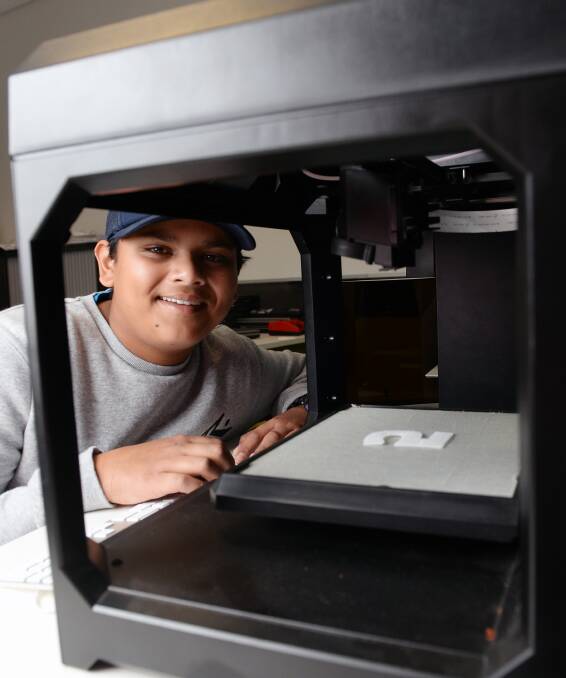 WAY OF THE FUTURE: Daymion Guru makes numbers on a 3D printer as part of his P-Tech studies at Federation College in Grant Street.