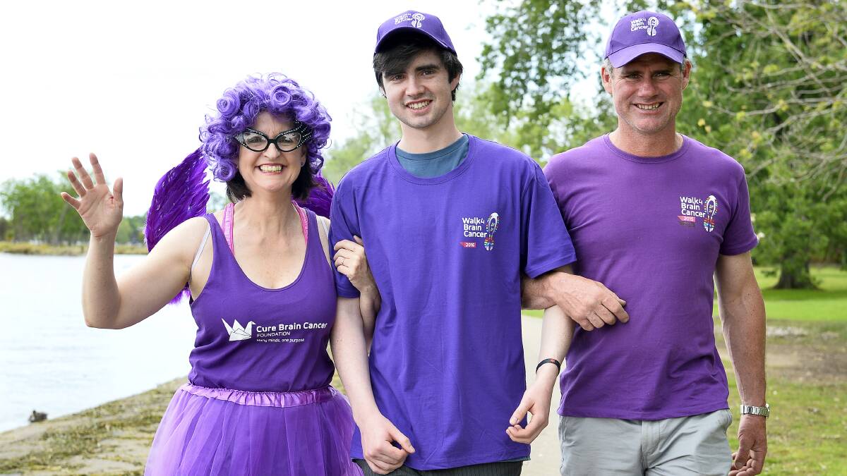 CANCER WALK: Raising awareness and funds for brain tumour research are Mitchell Prendergast, centre, with parents Emilie and Simon. Picture: Dylan Burns