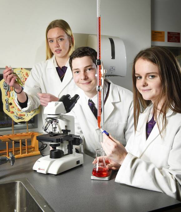 SCIENCE WITH A TWIST: Phoenix Community College P-12 students, from left, Ally Dennis, Escher Russell and Emiley Cody are part of the John Monash Science School emerging sciences program. Picture: Luka Kauzlaric