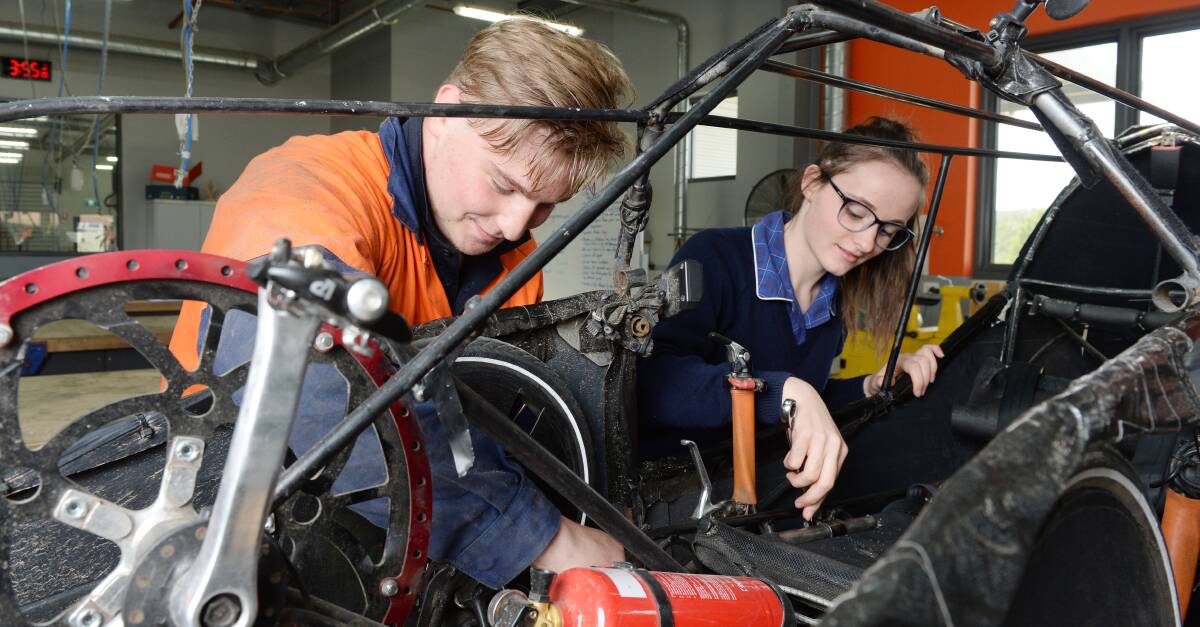 FINAL TOUCHES: Ballarat Christian College students Brendan Thomas and Caroline Debicki prepare for the RACV Energy Breakthrough Challenge. Picture: Kate Healy