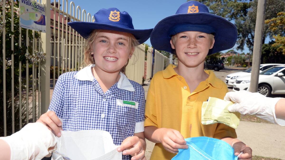 LEADING THE WAY: St Columba's Primary School grade three environmental representatives Talia and Archie at Schools Clean Up Australia Day. Picture: Kate Healy