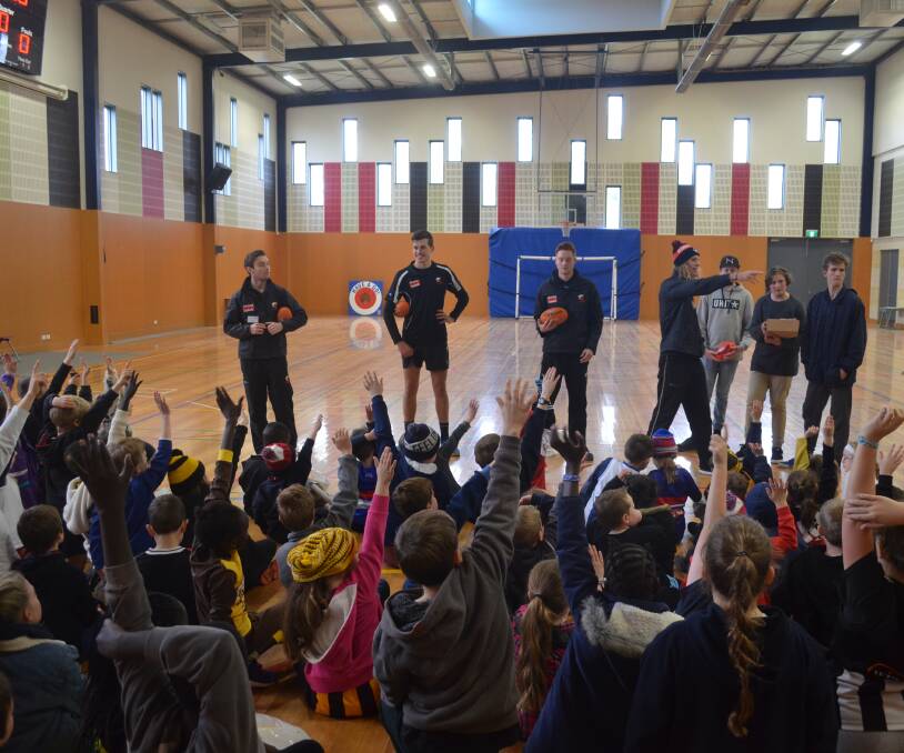 HANDS UP: Ballarat Christian College students were keen to take part in a footy clinic with the North Ballarat Roosters as part of a VCAL project. Picture: Sam Wiltshire
