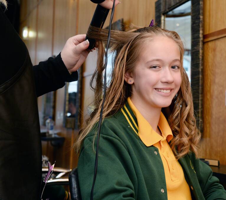 CURLY SITUATION: Ella, 10 enjoys getting some new ringlets as part of an Alfredton Primary School well-being initiative.