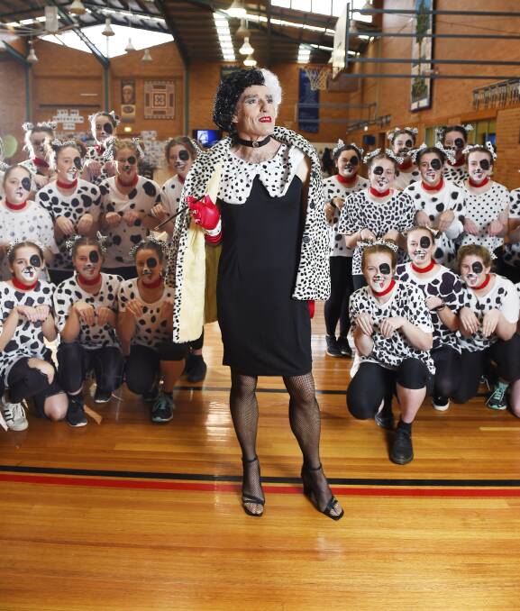 FEAST DAY: Loreto College deputy principal Pat O'Shea and his year 12 dalmations strike a pose for GBDay. Picture: Luka Kauzlaric