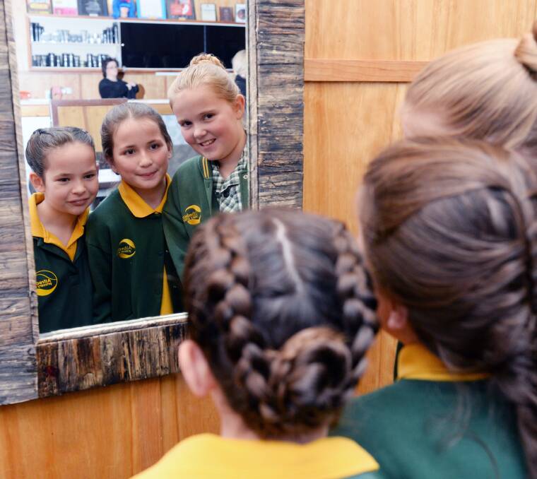 MAKEOVERS: Mikayla, 10, Emma, 10, and Anastasia, 10 admire their new hairdos. Pictures: Kate Healy