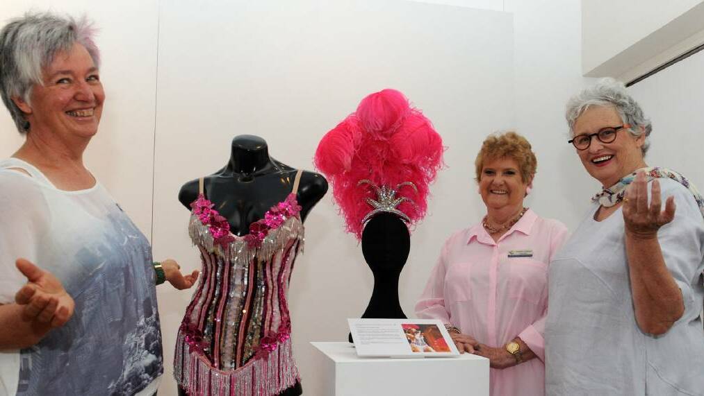 Ararat's Sue Kennedy, councillor Gwenda Allgood and Carole Mules get a sneak preview of Kylie's costumes. Picture: OLIVIA PAGE
