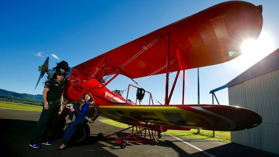 Southern Biplane Adventures pilot Chris Clark puts journalist Desiree Savage through a full aerobatics routine, similar to what you'd see from the ground at the Wings Over Illawarra air show. Picture: Adam McLean