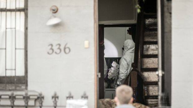 Forensic officers search a property in Surry Hills on Sunday. Photo: Brook Mitchell
