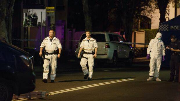 Bomb squad officers were among police who raided a terrace house in Surry Hills on Saturday night. Photo: Brook Mitchell
