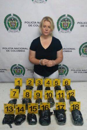 Colombian police released this photo of Cassandra Sainsbury with the drugs she is alleged to have smuggled. Photo: Colombian National Police