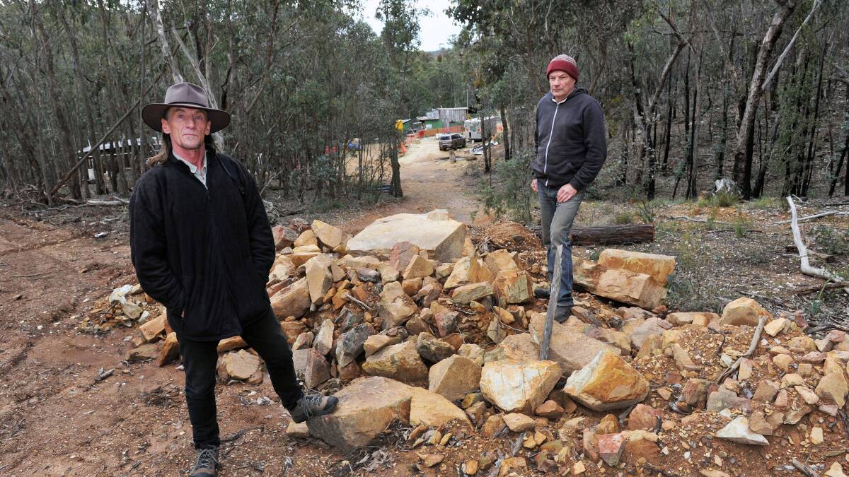 ANGERED: David Stephens and Murray Ralph investigate the proposed mining site at the Wombat State Forest. Picture: JULIE HOUGH