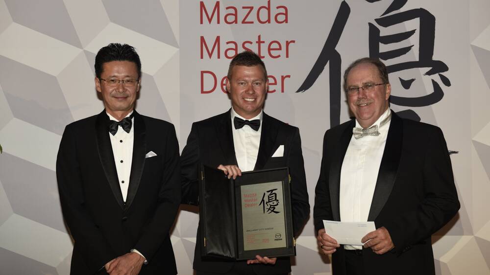 WINNER: The Ballarat Mazda managing director, Justin Kroussoratis, accepts the Mazda Master Dealer award from Mazda Australia officials.