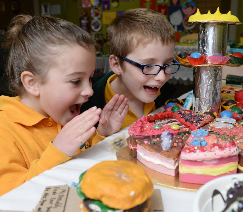 YUM: Alfredton Primary School grade 1 pupils Milla Hunter and Fletcher McConachy with the colourful display of food. Picture: Kate Healy