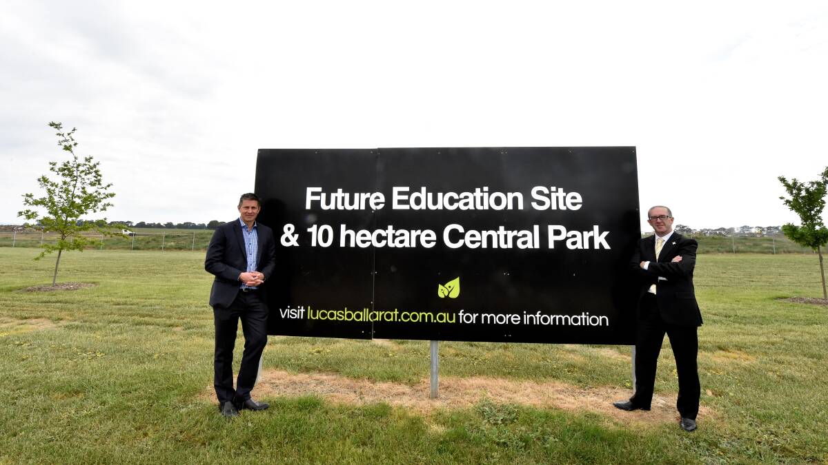 FUTURE: Integra land development manager Nick Grylowicz and Father Justin Driscoll at the Lucas site of the new Catholic primary school which will open in 2018.