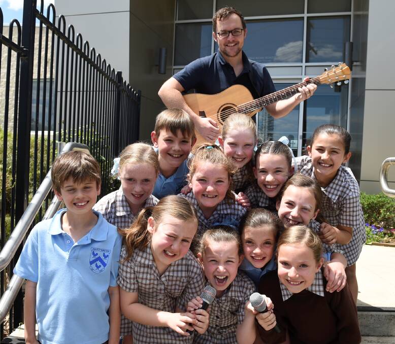 SINGING JOY: St Thomas More Primary School pupils joined more than 500,000 children across Australia to sing the same song, at the same time for Music: Count Us In. Picture: Lachlan Bence