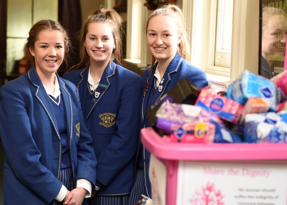 GOODWILL: Students Ellen Mason, Gemma Foord and Hannah Armstrong are collecting goods for Share the Dignity campaign. Picture: Lachlan Bence