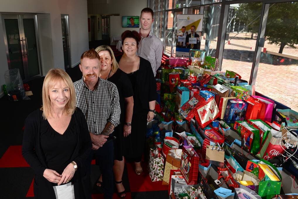 DONATION: Leadership Ballarat and Western Region donate to the CAFS Christmas appeal. Deb Darlow, Neil Boyack, Alana Cornwell, Sofia Fiusco and Ewen Fletcher. Picture: Dylan Burns