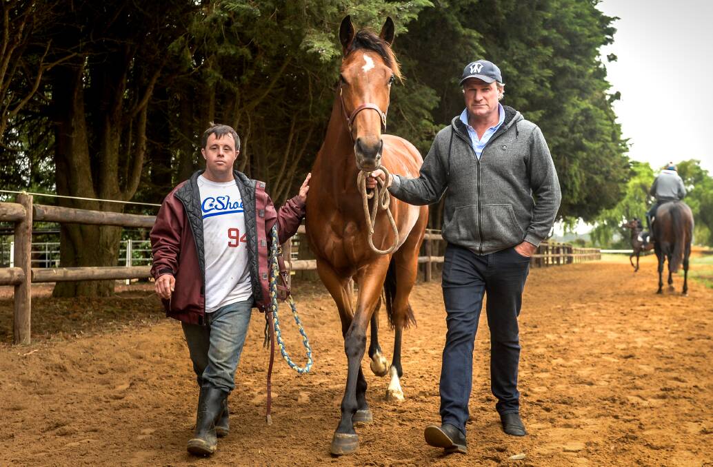 WINNERS: A couple of days after the excitement of winning the Melbourne Cup, Stevie Payne was back at work with trainer Darren Weir at Forest Lodge stables. 