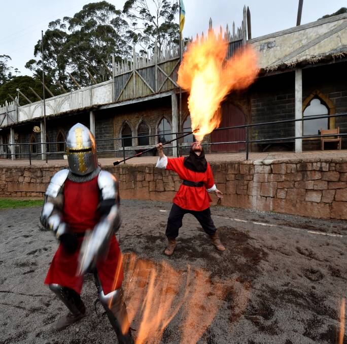 FIERY FUN: Sir Hector (Cliff Formosa), Cicero the Fire Eater (Matthew Keating) and The Black Knight (Phillip Leitch) battling with fiery swords. 