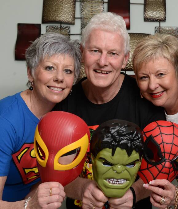 SUPERHEROES: The Ballarat Pink Phoenix Breast Cancer Support Group members (from left) Jan Conroy, Brendan Britt and Gillian Britt will dress up as superheroes at the charity ball. Picture: Kate Healy 
