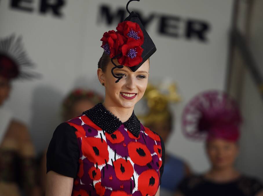 SPRING SENSATION: Allie Guy was inspired by bright red poppies to create her matching ensemble. Picture: Luka Kauzlaric