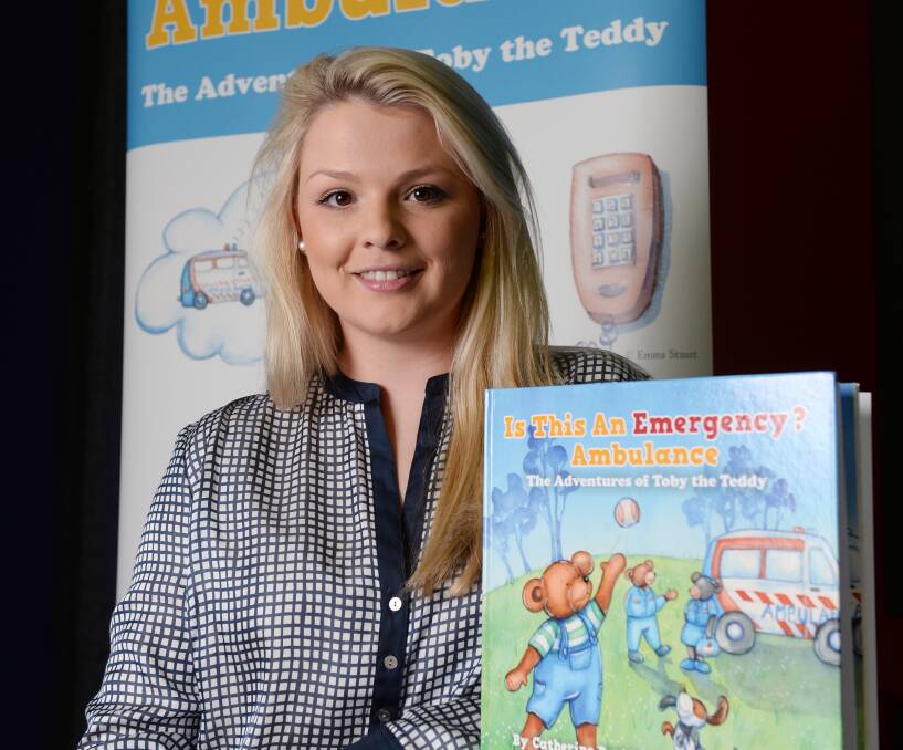 WHEN TO DIAL: Paramedicine graduate Amelia Harrison has written a book teaching children the difference between an accident and an emergency. Picture: Kate Healy