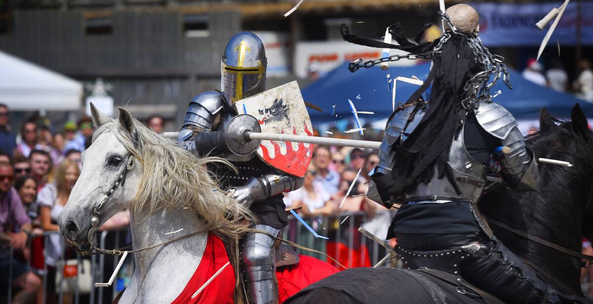 KNIGHTS IN ARMOUR: Sir Hector and the Black Knight compete in the jousting championships. Picture: Luka Kauzlaric 