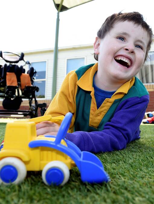 EMBRACING LIFE: Joseph Stewart, 7, lives with a life-threatening form of epilepsy but he does not let that stop him from embracing life. Picture: Lachlan Bence 