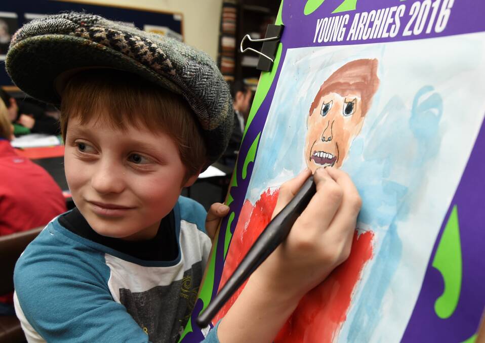 ASPIRING ARTIST: Jack McMurtrie paints a picture for the Young Archies. Picture: Lachlan Bence
