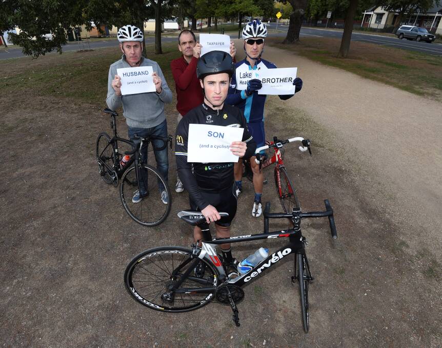 MUTUAL RESPECT: Cyclists hold up signs during a solidarity ride to urge all road users to respect cyclists. Picture: Lachlan Bence 