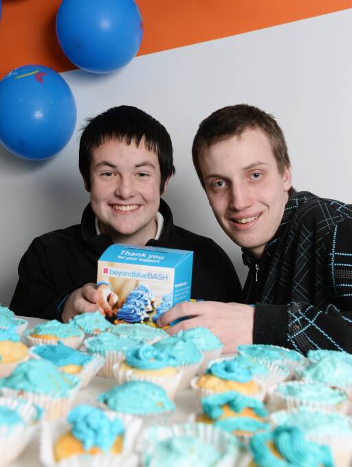 HIGHLIGHTING MENTAL HEALTH: Mount Clear Secondary College students Rodney Williams, 17 and Caelum O'Mara, 16, try out some yummy cakes. Picture: Kate Healy