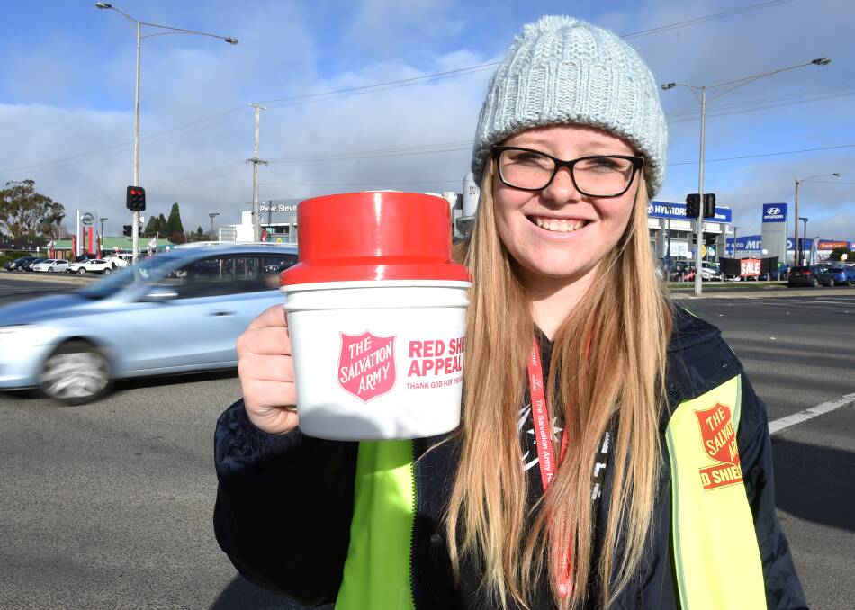 HELPING HAND: Najette Van Gaalen spent a freezing Saturday morning rattling tins for the needy on Creswick Road for the Red Shield Appeal. 
