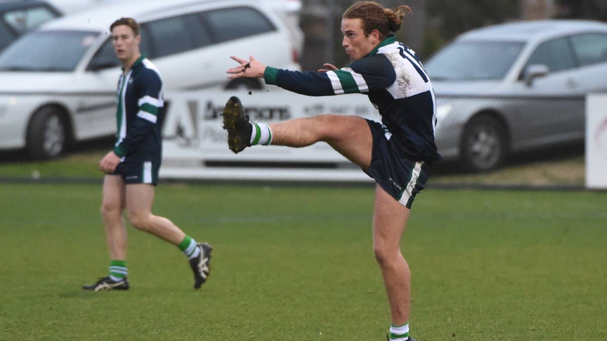 STAR POWER: St Pats captain Nick Stuhldreier sends a kick forward in the BAS grand final earlier this year. Photo: Jeremy Bannister.